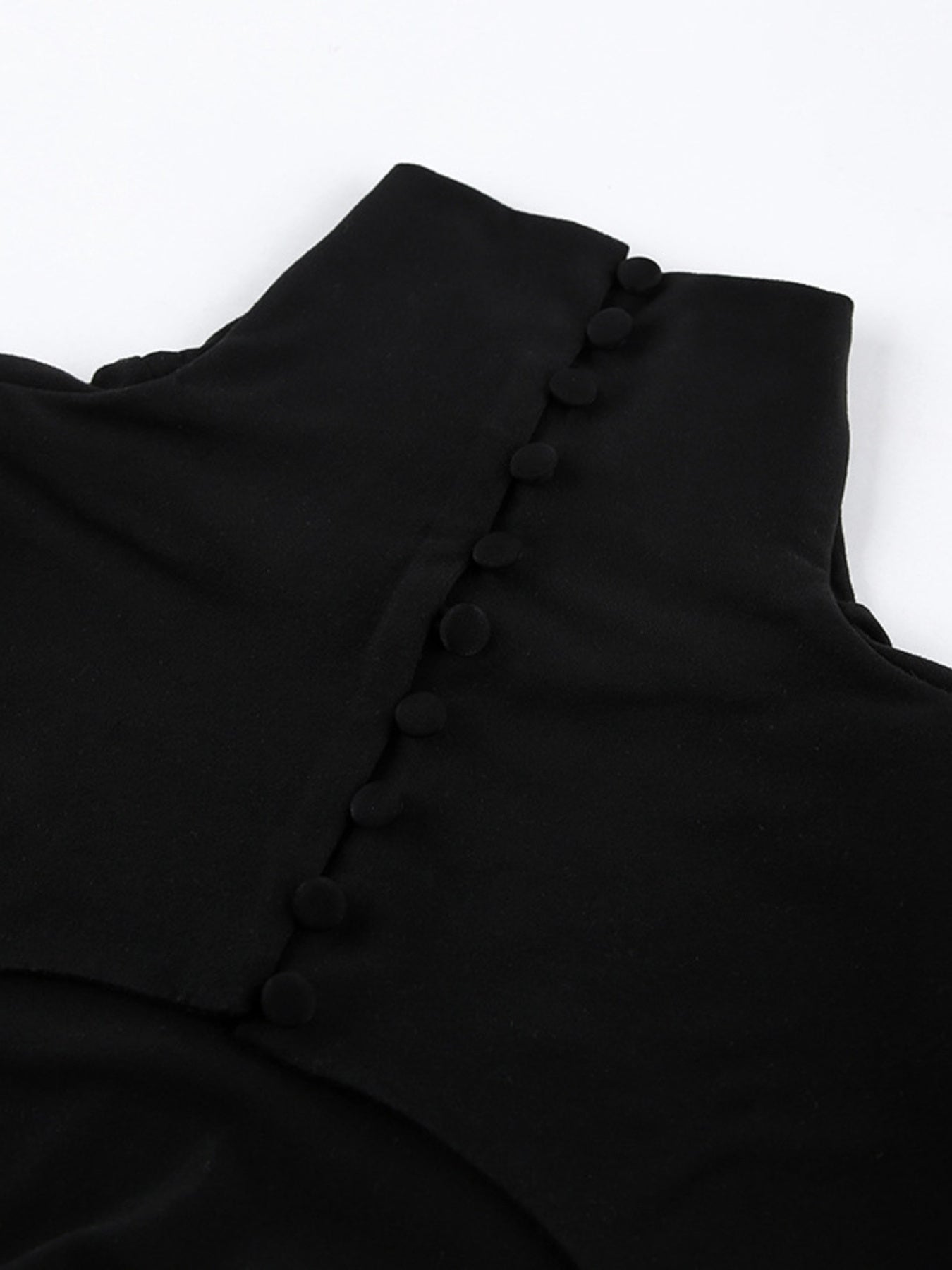 Black turtleneck collar with button placket detail on backless maxi dress
