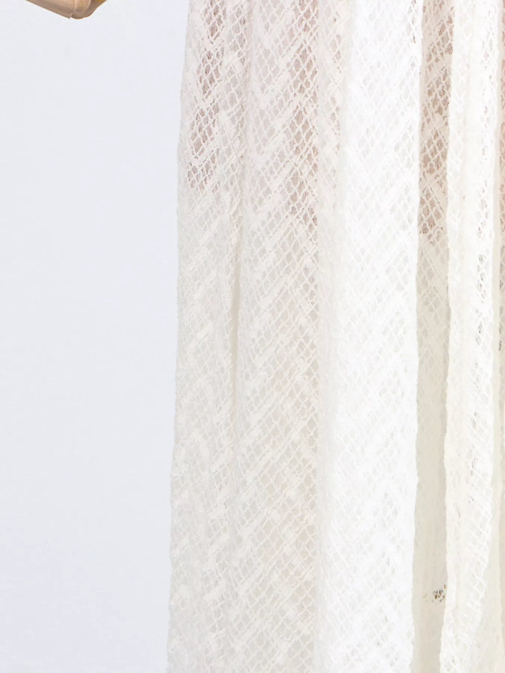 White lace long-sleeve maxi dress side panel, sheer textured fabric with vertical seams