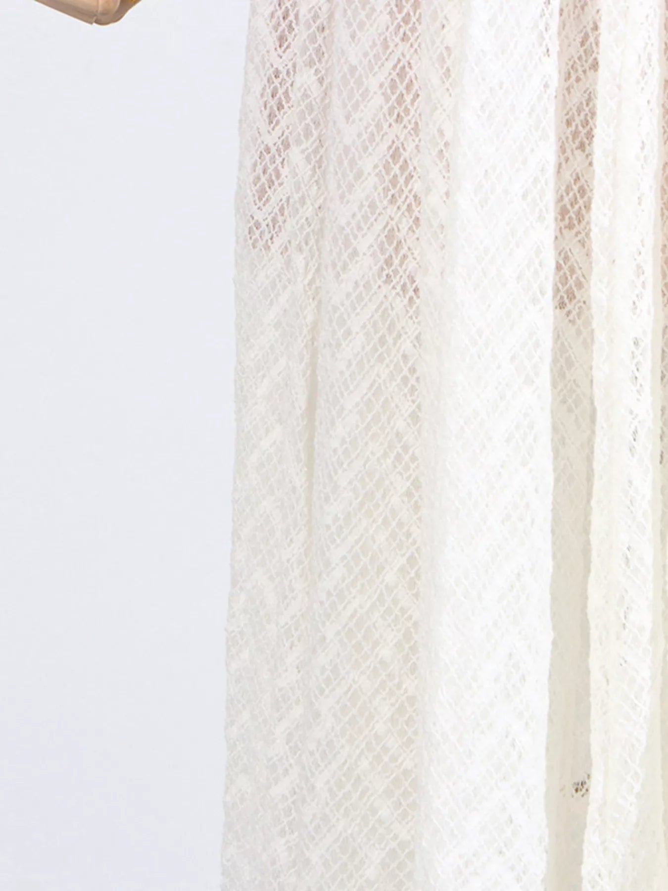 White lace long-sleeve maxi dress side panel, sheer textured fabric with vertical seams