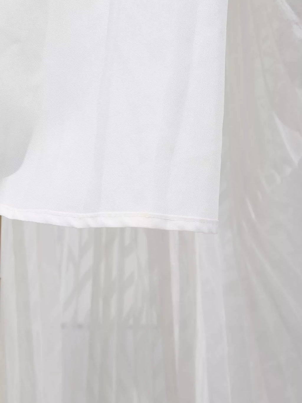 White long sleeve maxi dress with V-neck and ruffled hem