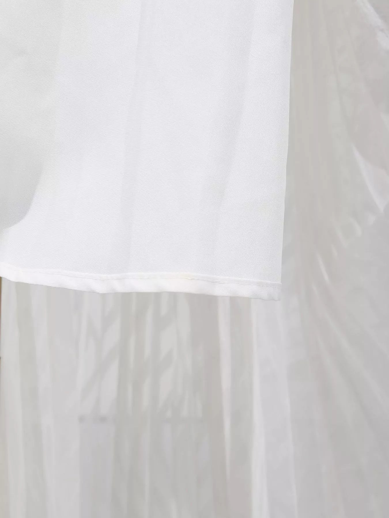 White long sleeve maxi dress with V-neck and ruffled hem