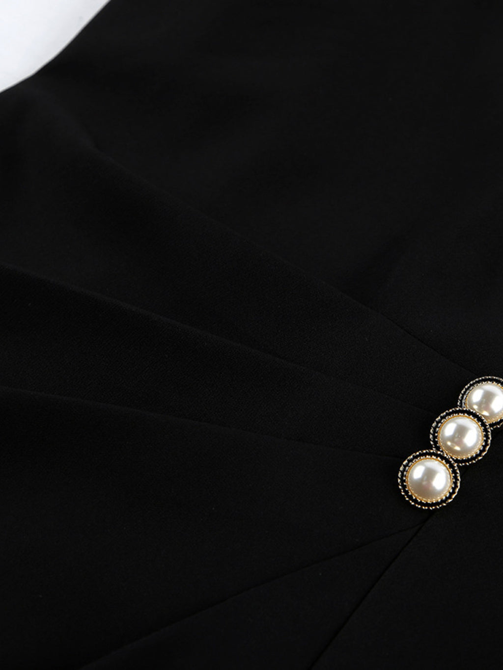 Black ruched surplice long-sleeve dress with faux pearl neckline detail