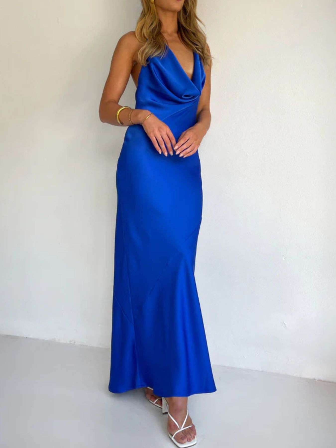 Blue satin halter maxi dress with draped neckline and ankle-length fitted skirt