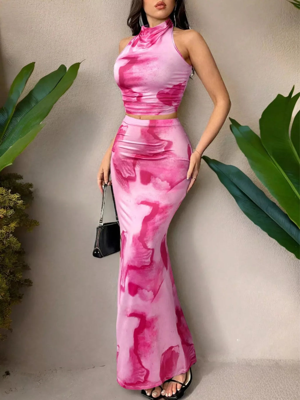 Women’s halter top and mermaid skirt set in pink tie-dye, fitted silhouette