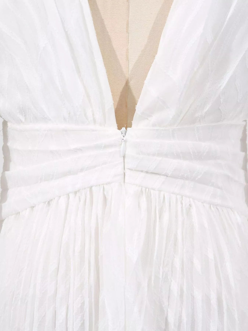White dress bodice with ruched center seam and layered skirt tiers
