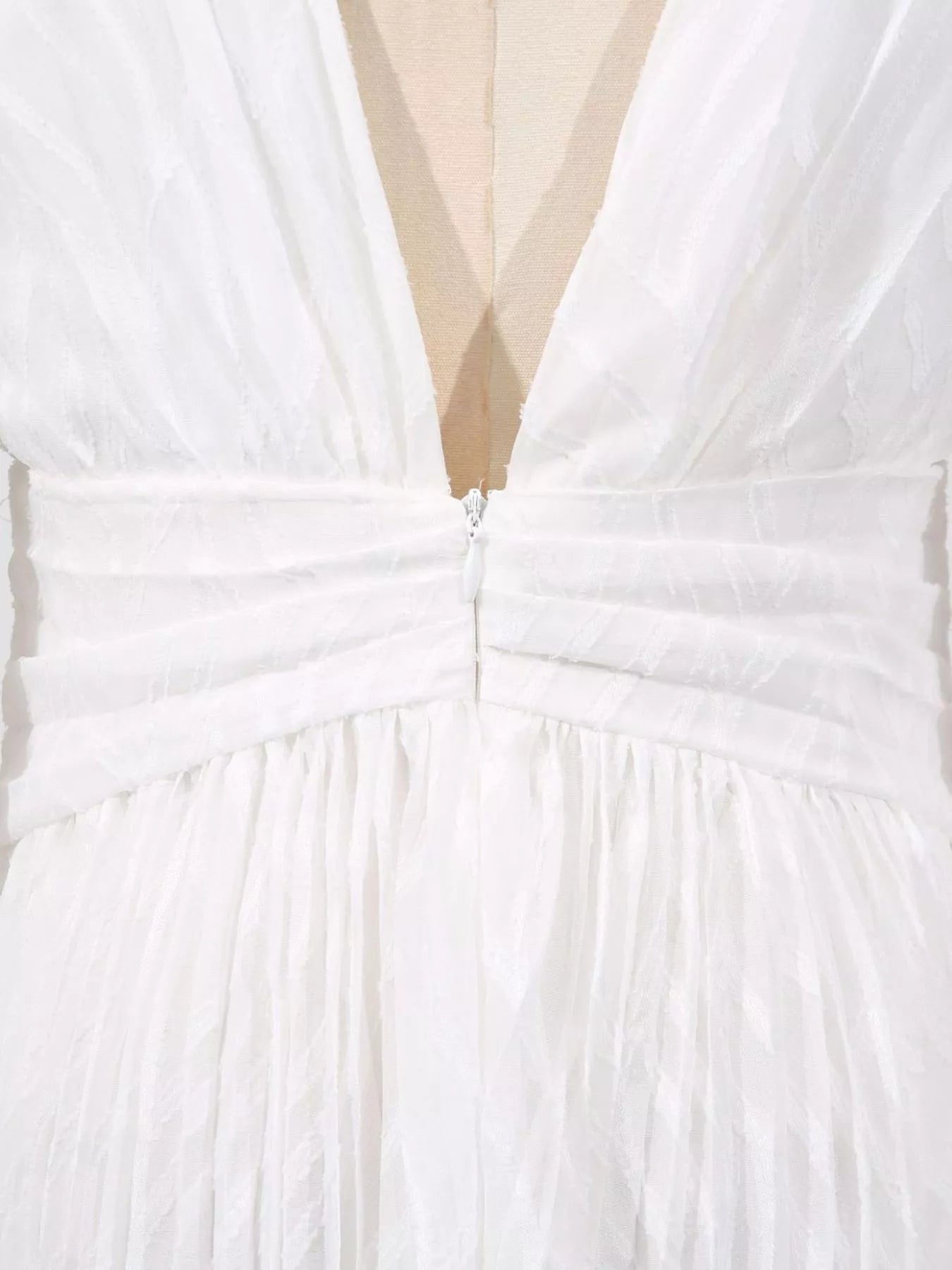 White dress bodice with ruched center seam and layered skirt tiers
