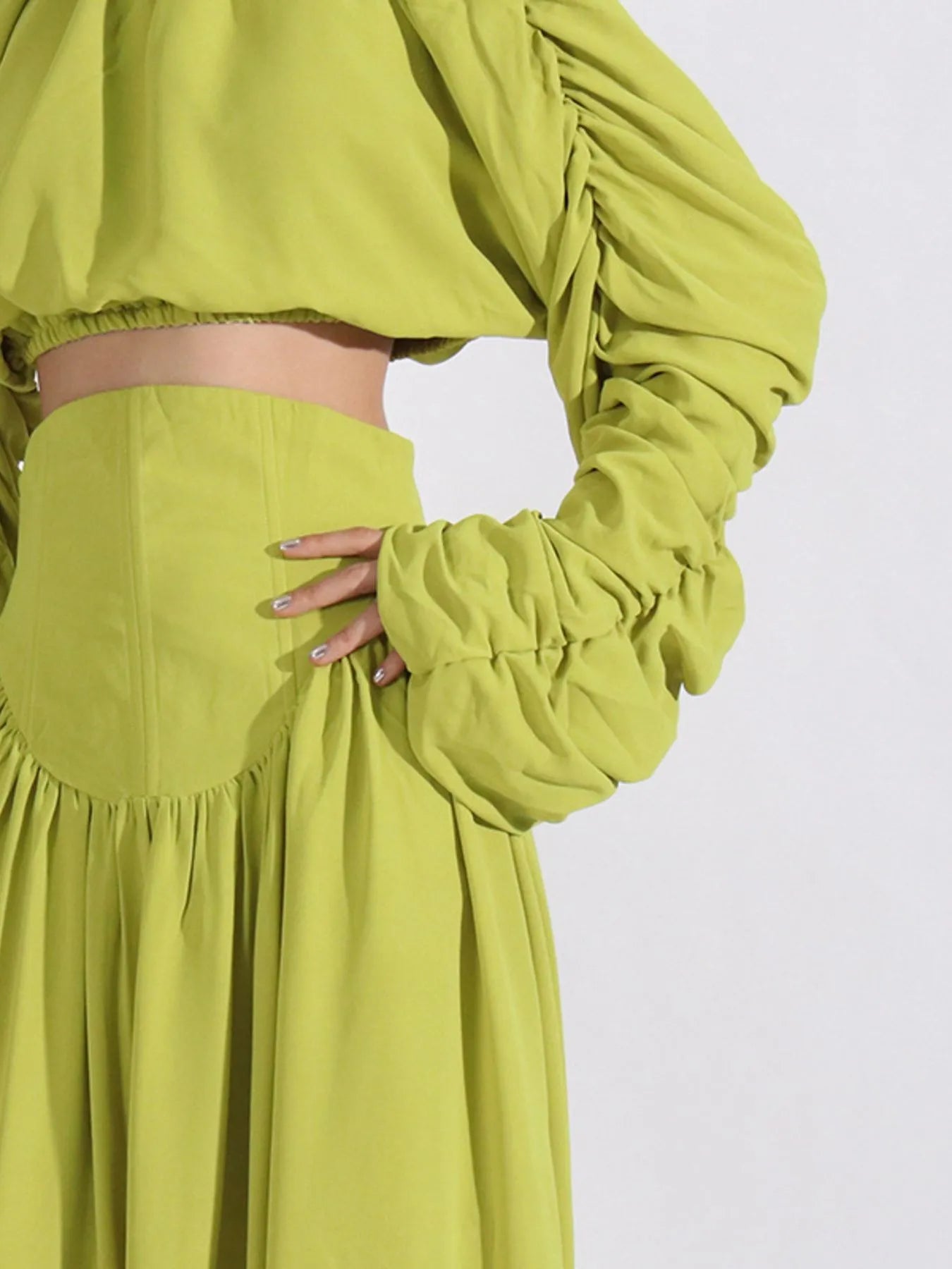 Green ruched long-sleeve crop top and high-waist skirt with gathered waist