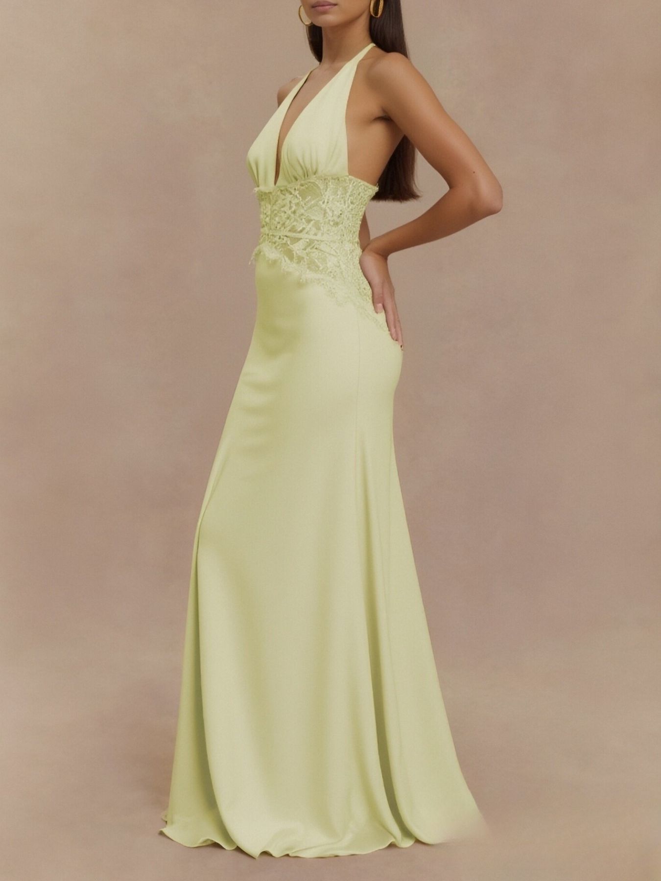 Light yellow halter maxi dress with lace bodice and fitted waist, side view long skirt
