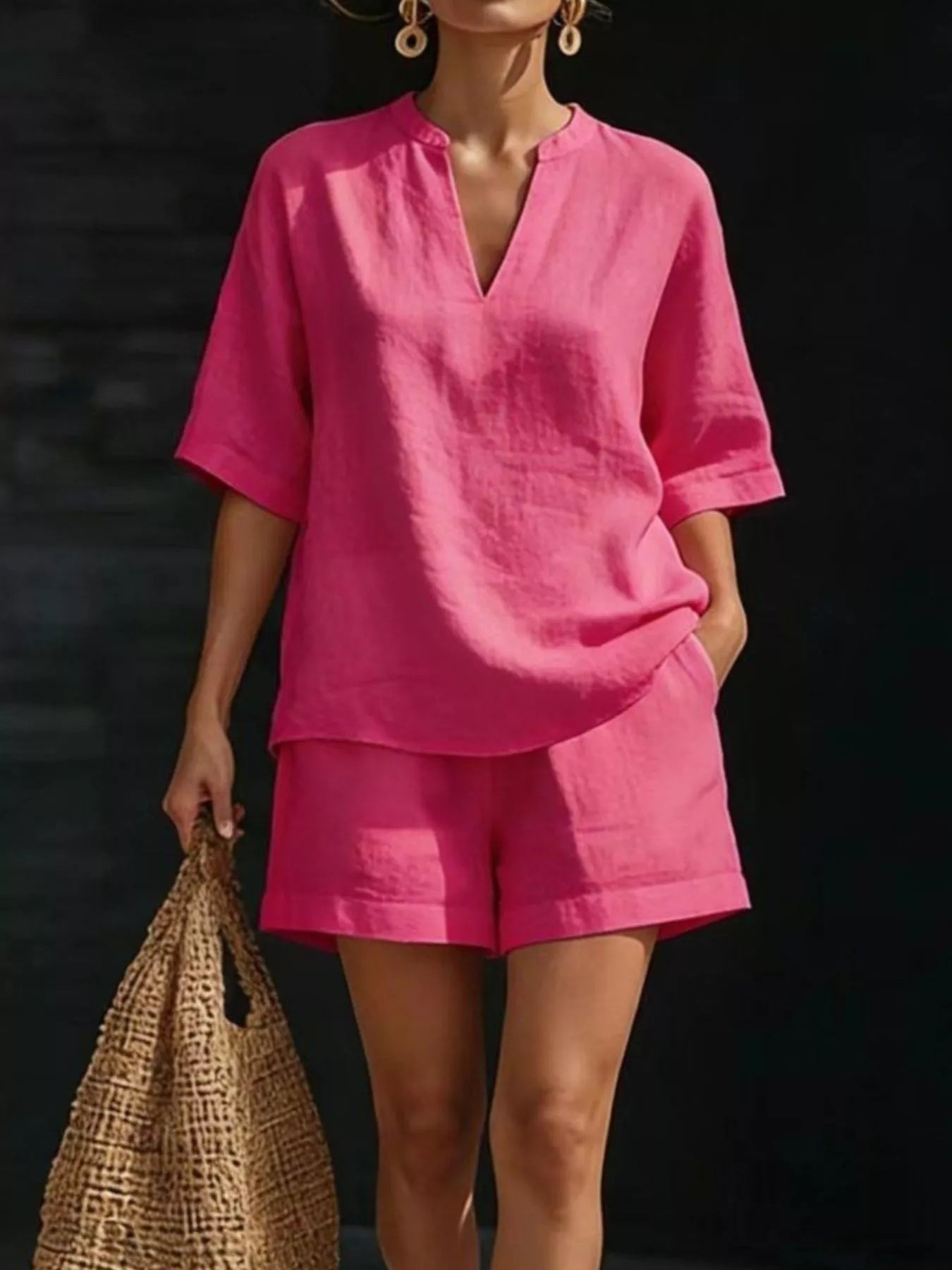 Fuchsia pink half-sleeve V-neck top and matching shorts set with notched neckline