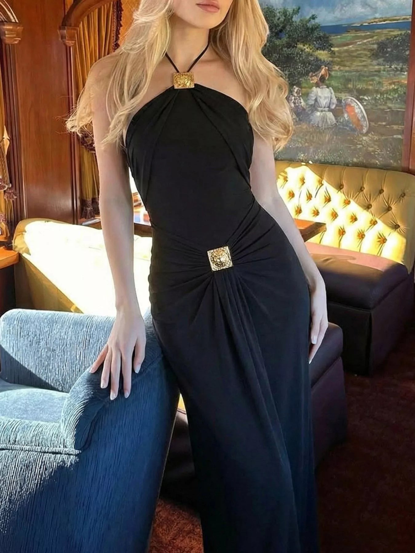 Black backless halter maxi dress with jeweled buckle accents and gathered skirt