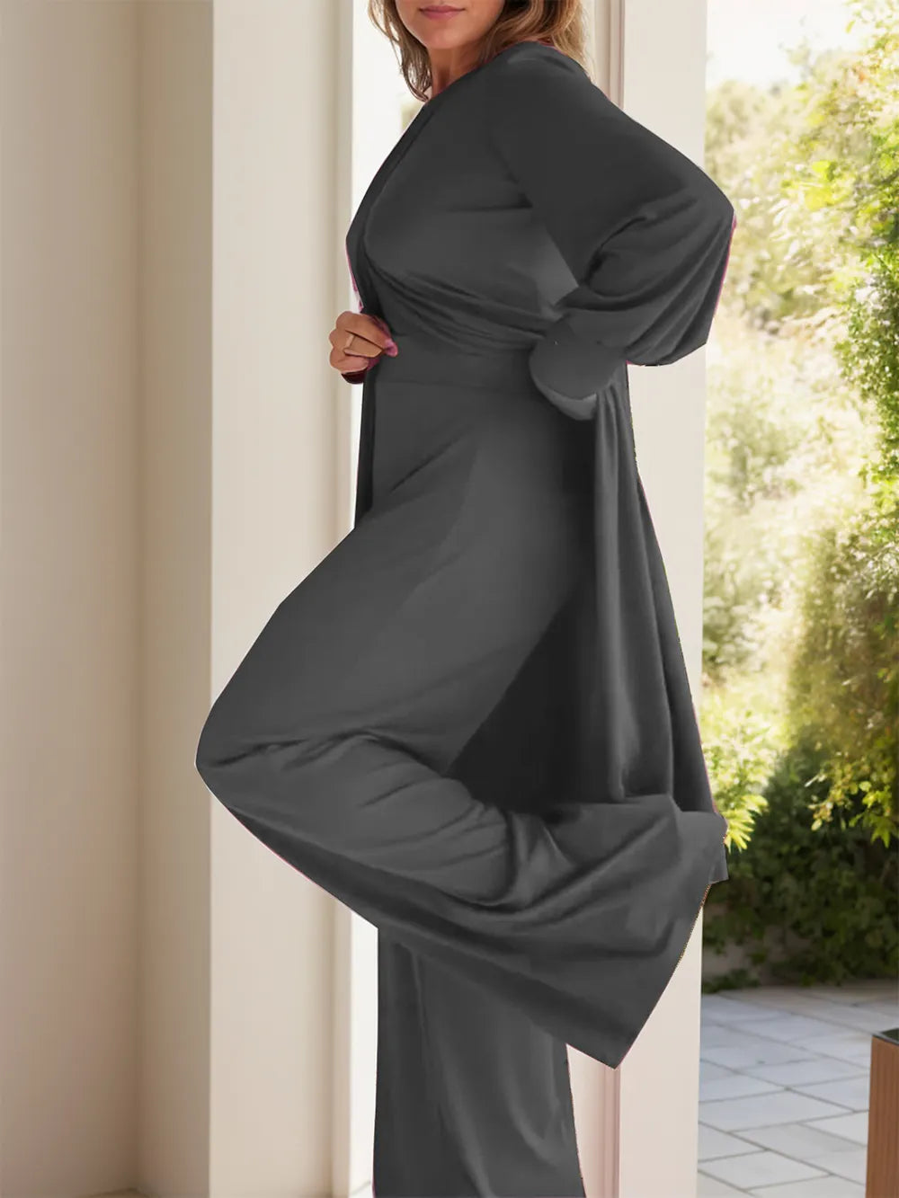 Two-piece slit top and pants set, dark gray, long sleeves and round neck.