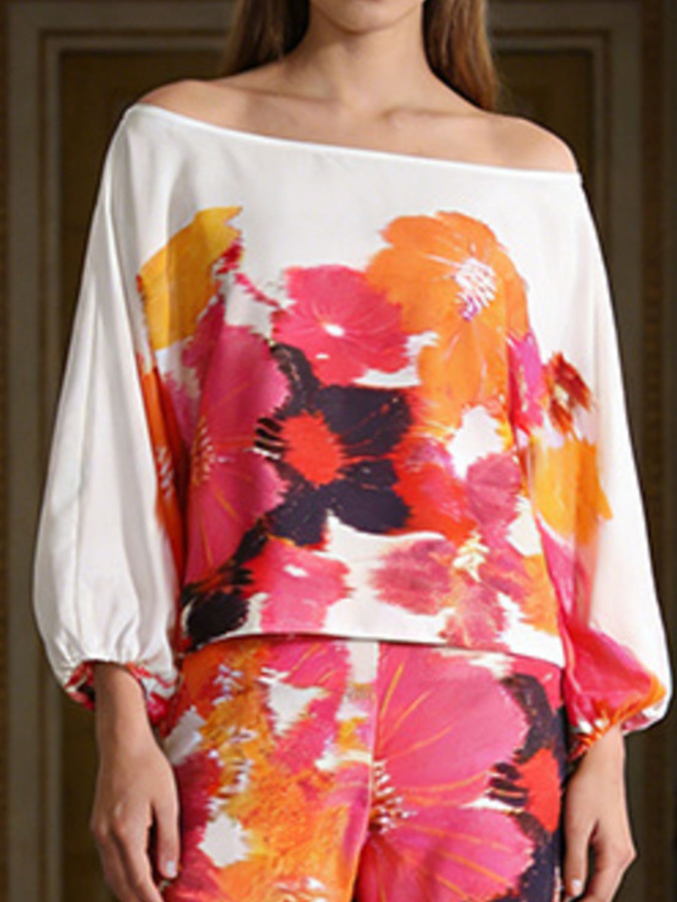 Off-shoulder floral top in white with bold multicolor flower print