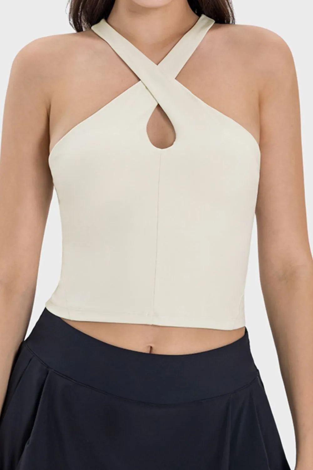 Cream active cami with crisscross Grecian neckline and keyhole cutout front