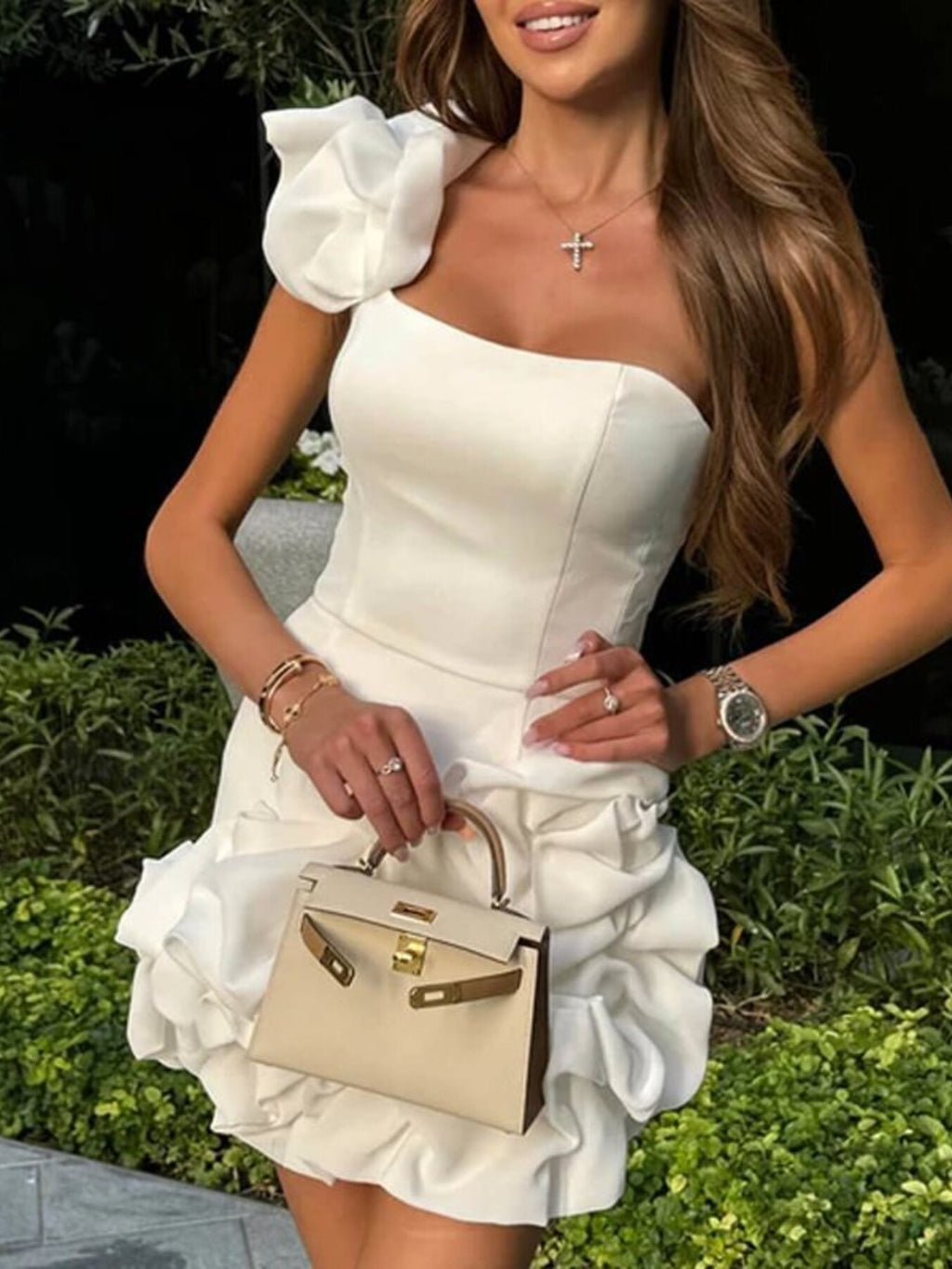 White one-shoulder ruffle mini dress with large sleeve and layered skirt ruffles