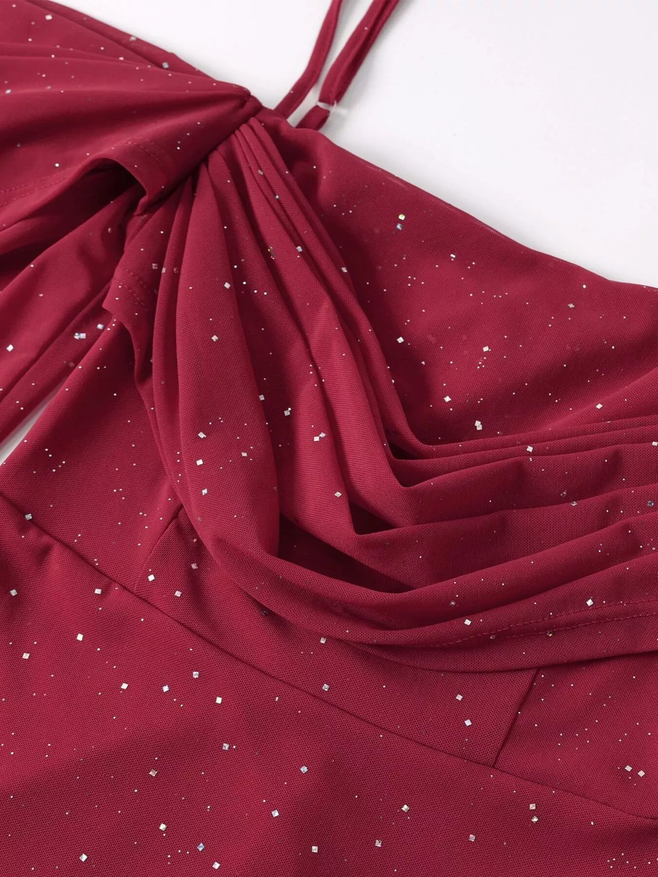 Wine red glitter fabric with gathered folds and sparkling specks detail