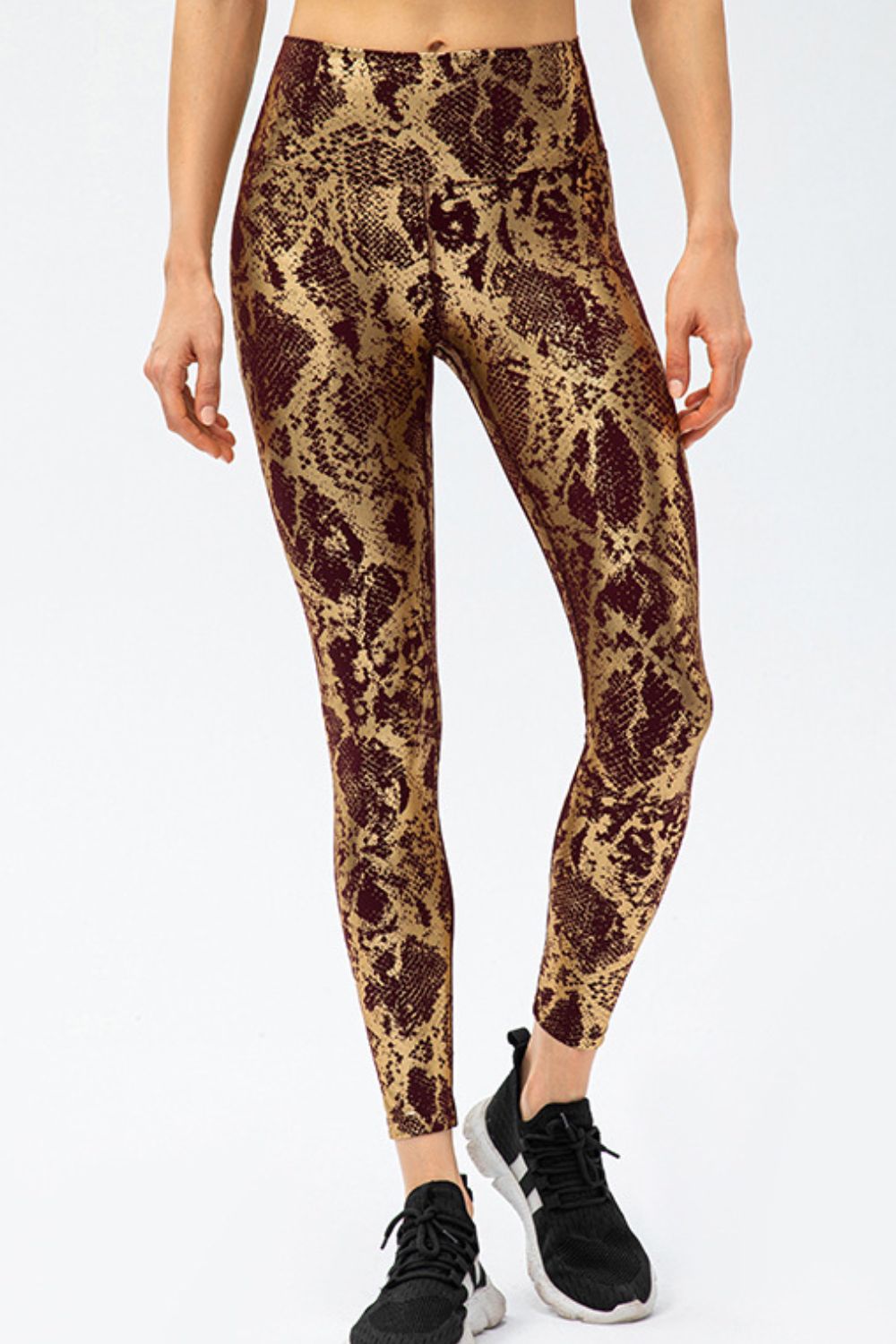 Animal-print slim-fit long sports pants with wide waistband, caramel and brown snake pattern.