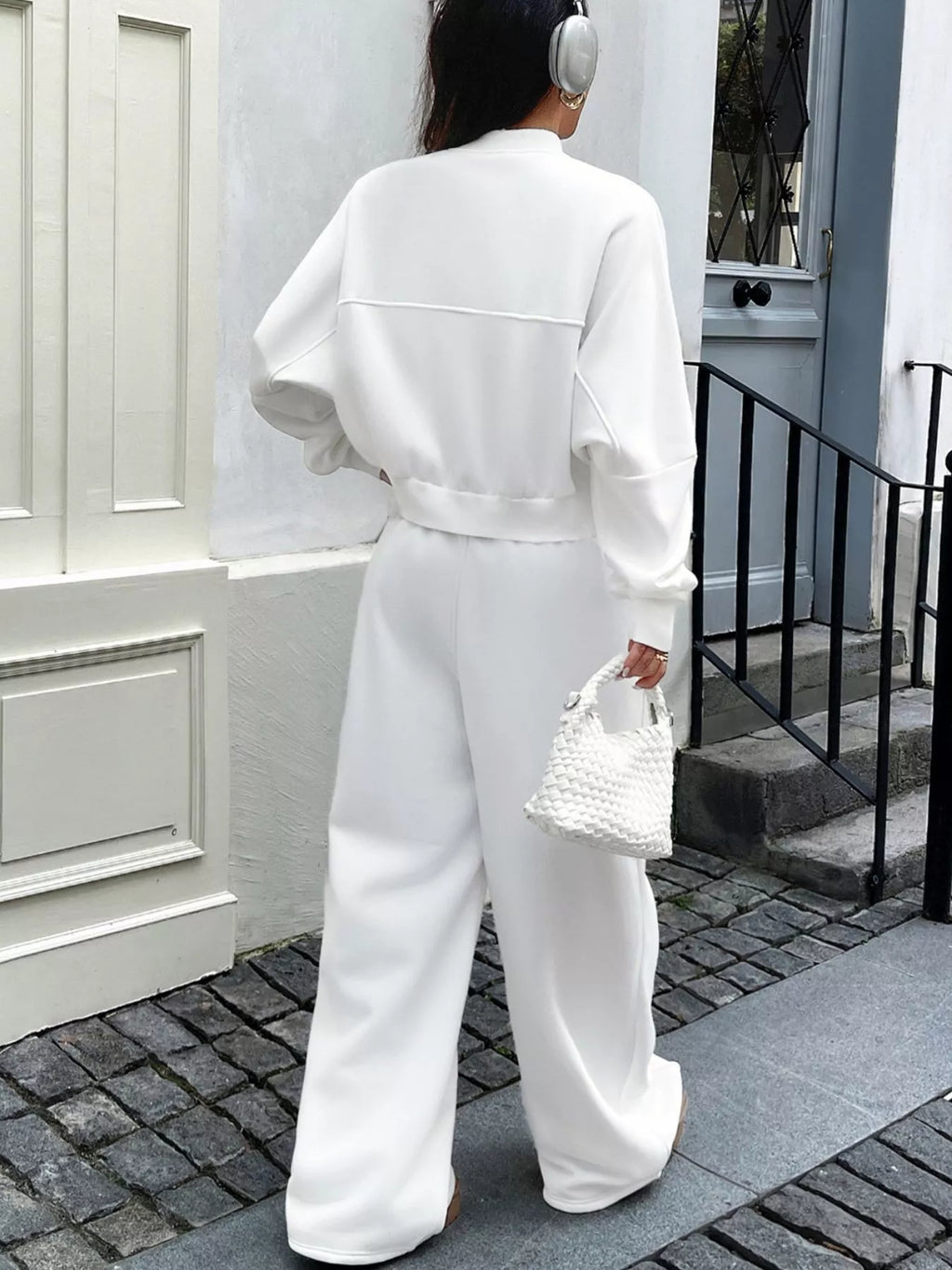 White zip-up jacket and wide-leg pants set, back view