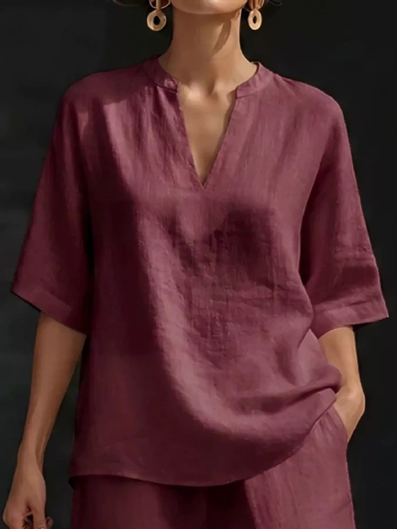 Red half-sleeve V-neck top with notched neckline and matching shorts