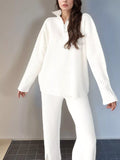 Ribbed knit top and pants set in white with half-zip mock collar and long sleeves