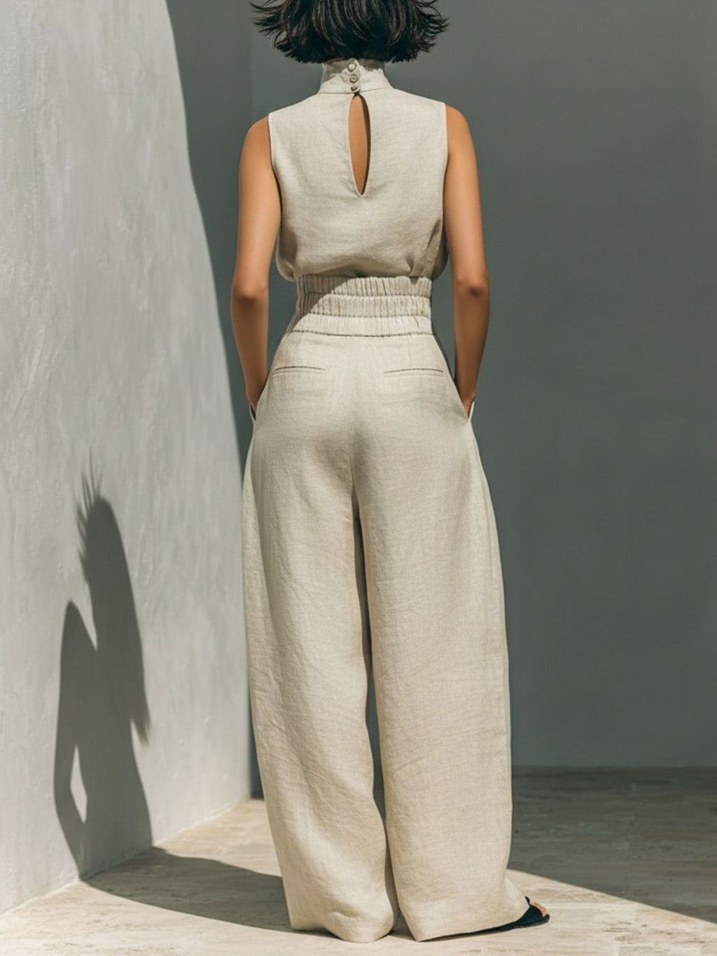 Ivory sleeveless turtleneck top and wide-leg pants set, back view with keyhole