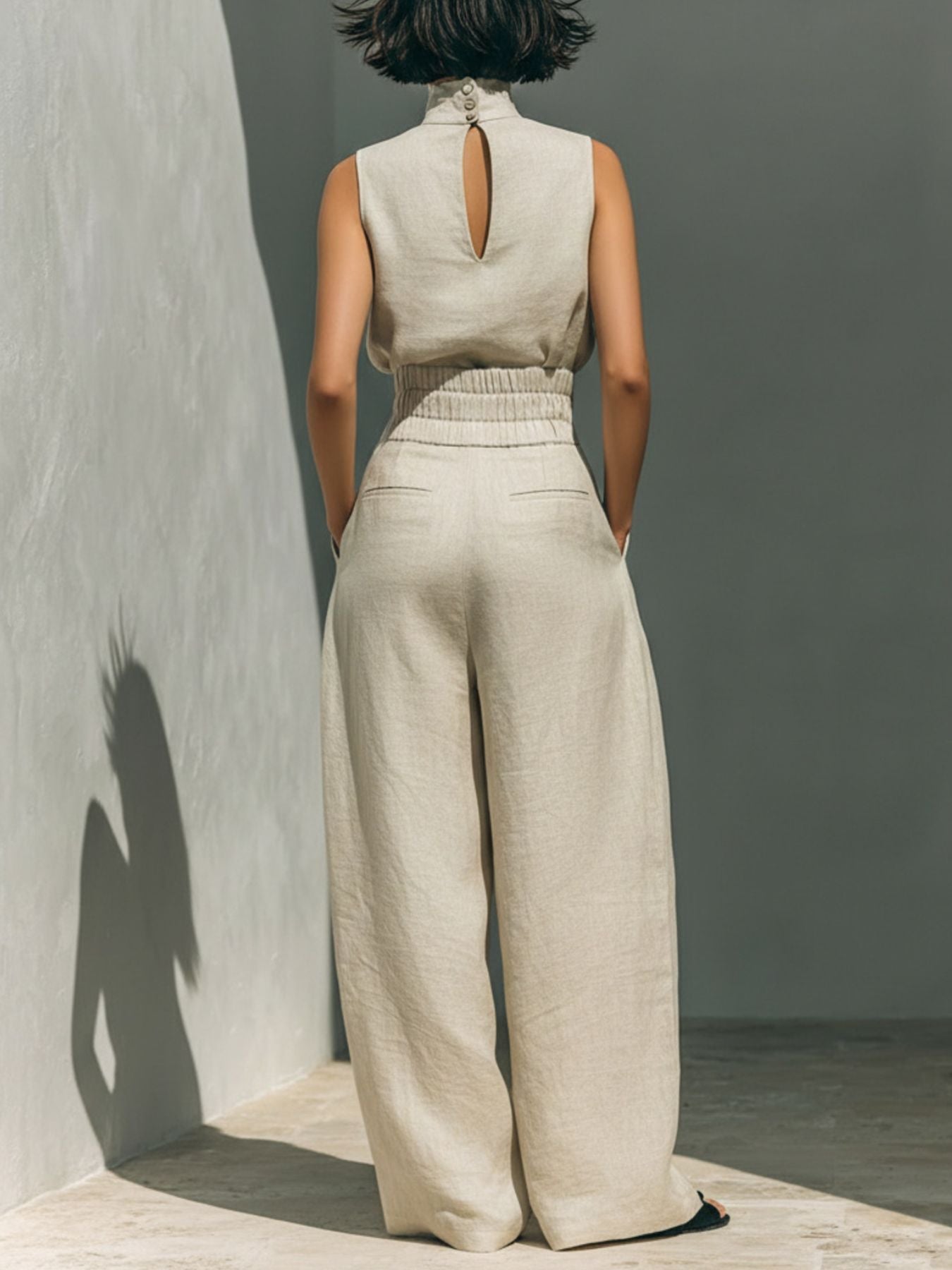 Ivory sleeveless turtleneck top and wide-leg pants set, back view with keyhole