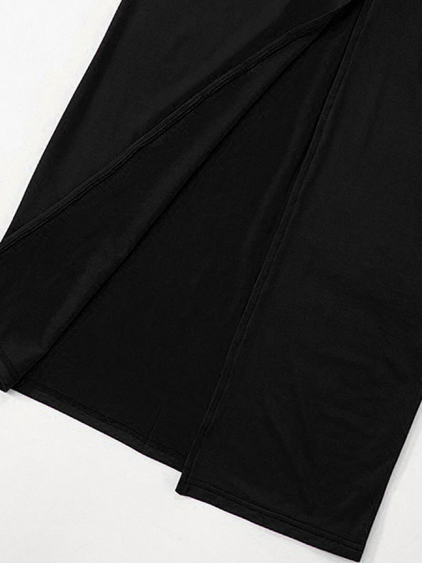 Close-up of black off-shoulder maxi dress fabric and seam detailing