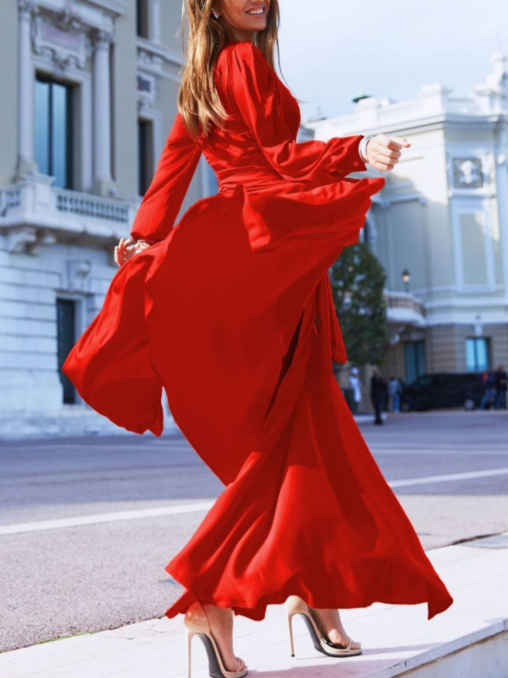 Deep red surplice maxi dress with long sleeves, surplice neckline, flowing hem, slit