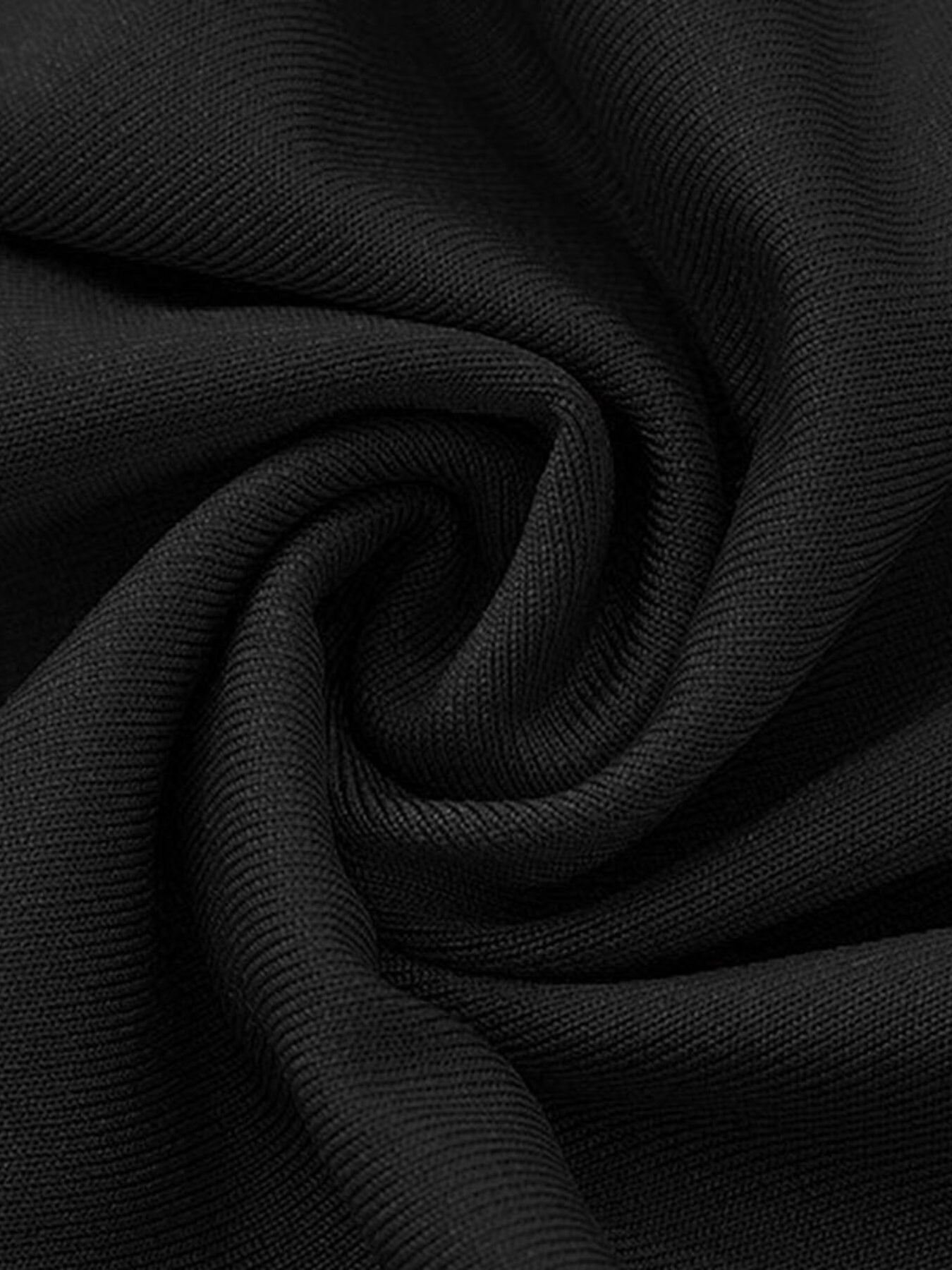 Black textured fabric close-up with fine ribbed weave