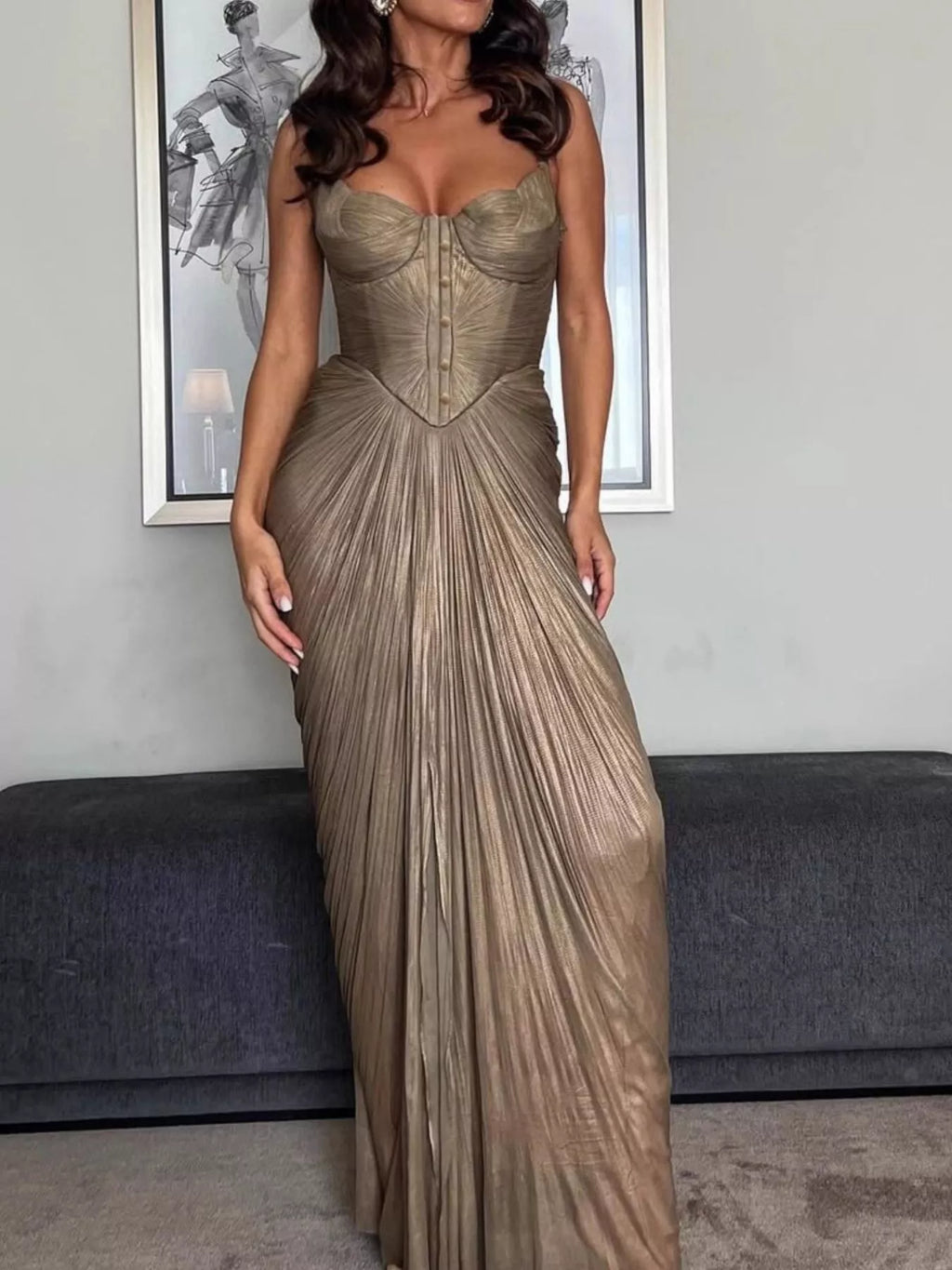Gold metallic pleated corset maxi dress with structured cups and vertical boning