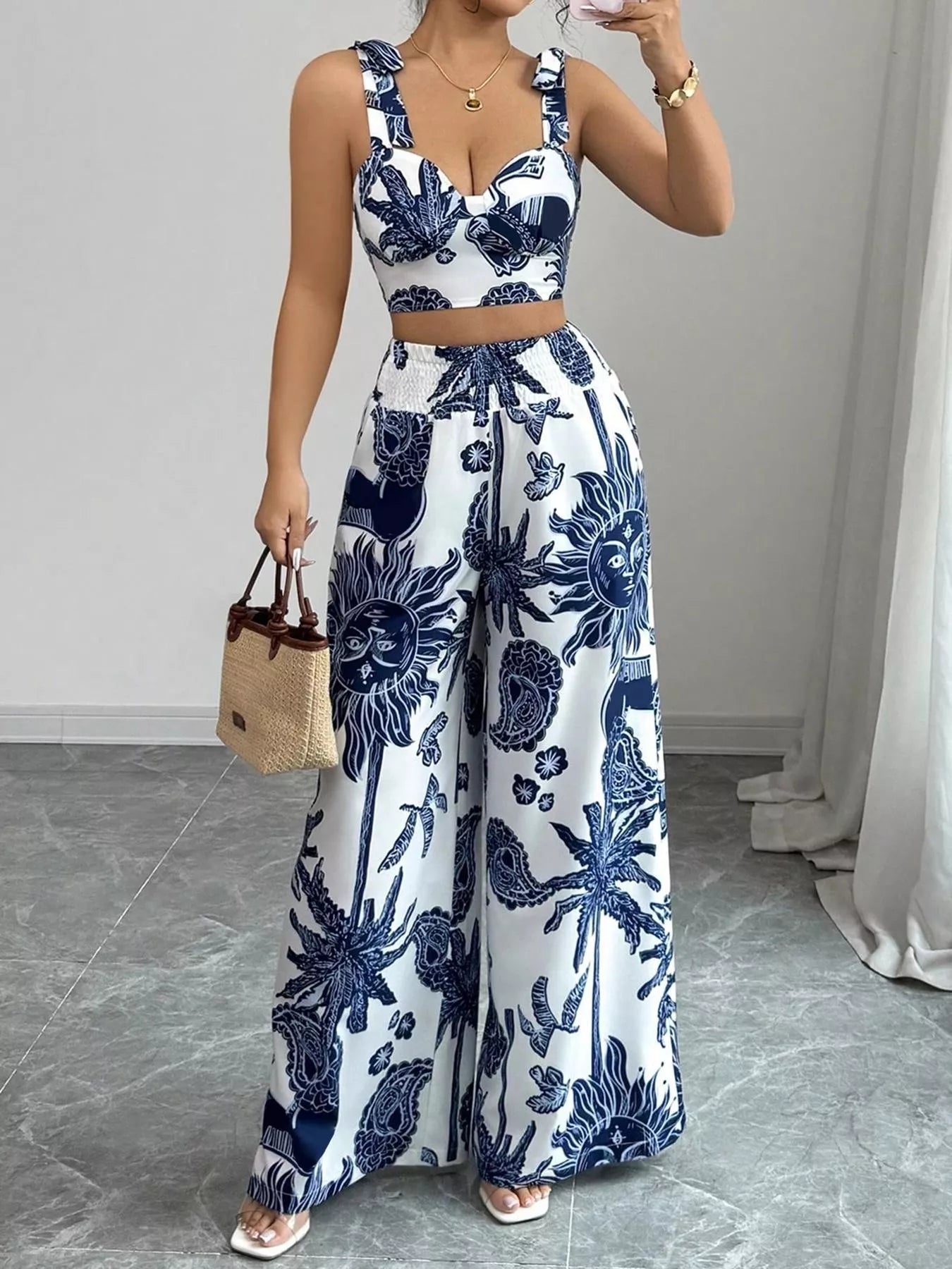 Blue and white floral crop top and wide-leg pants set with smocked waist detail
