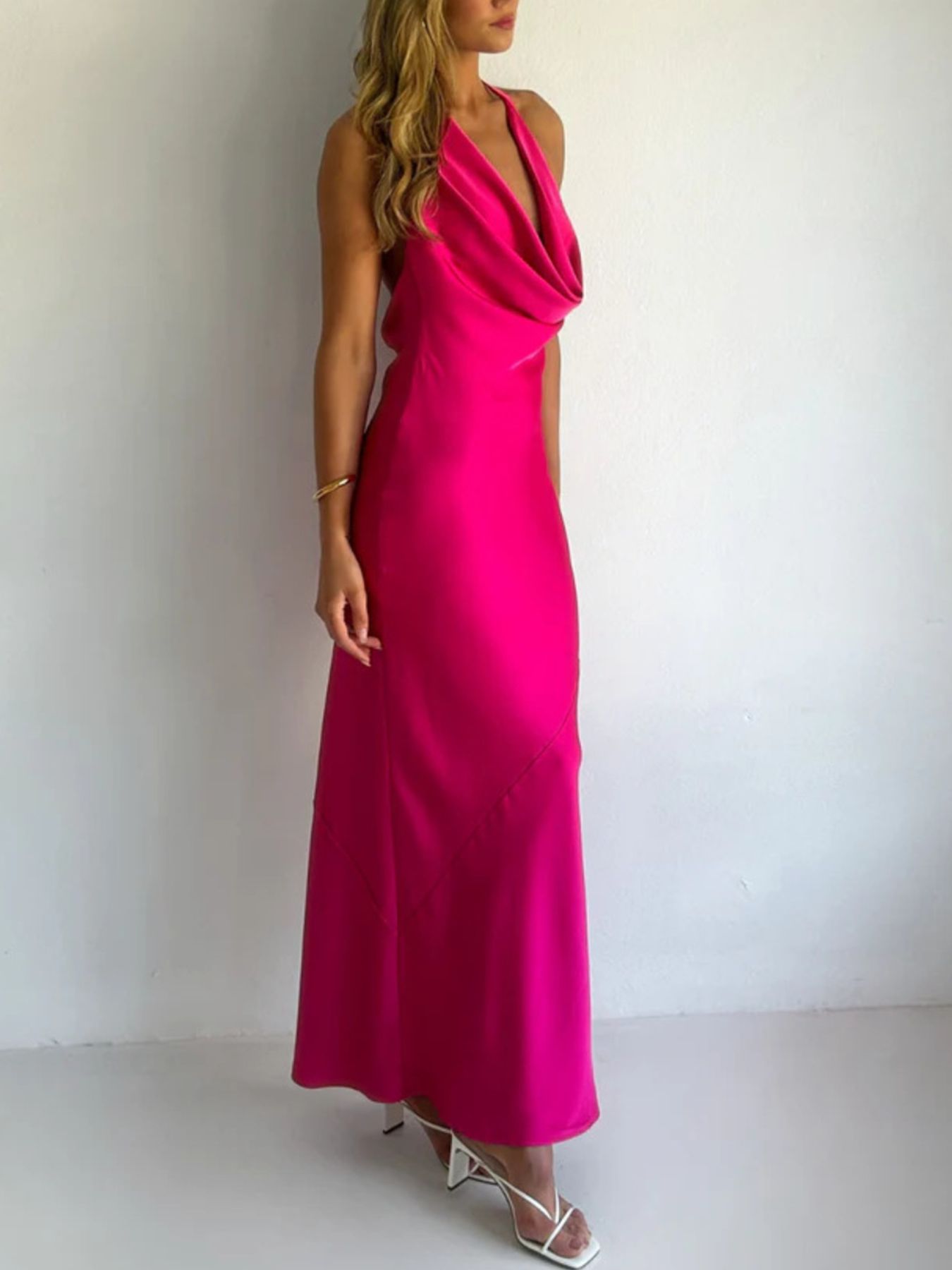 Rose-pink satin halter maxi dress with crossover halter neckline and floor-length skirt