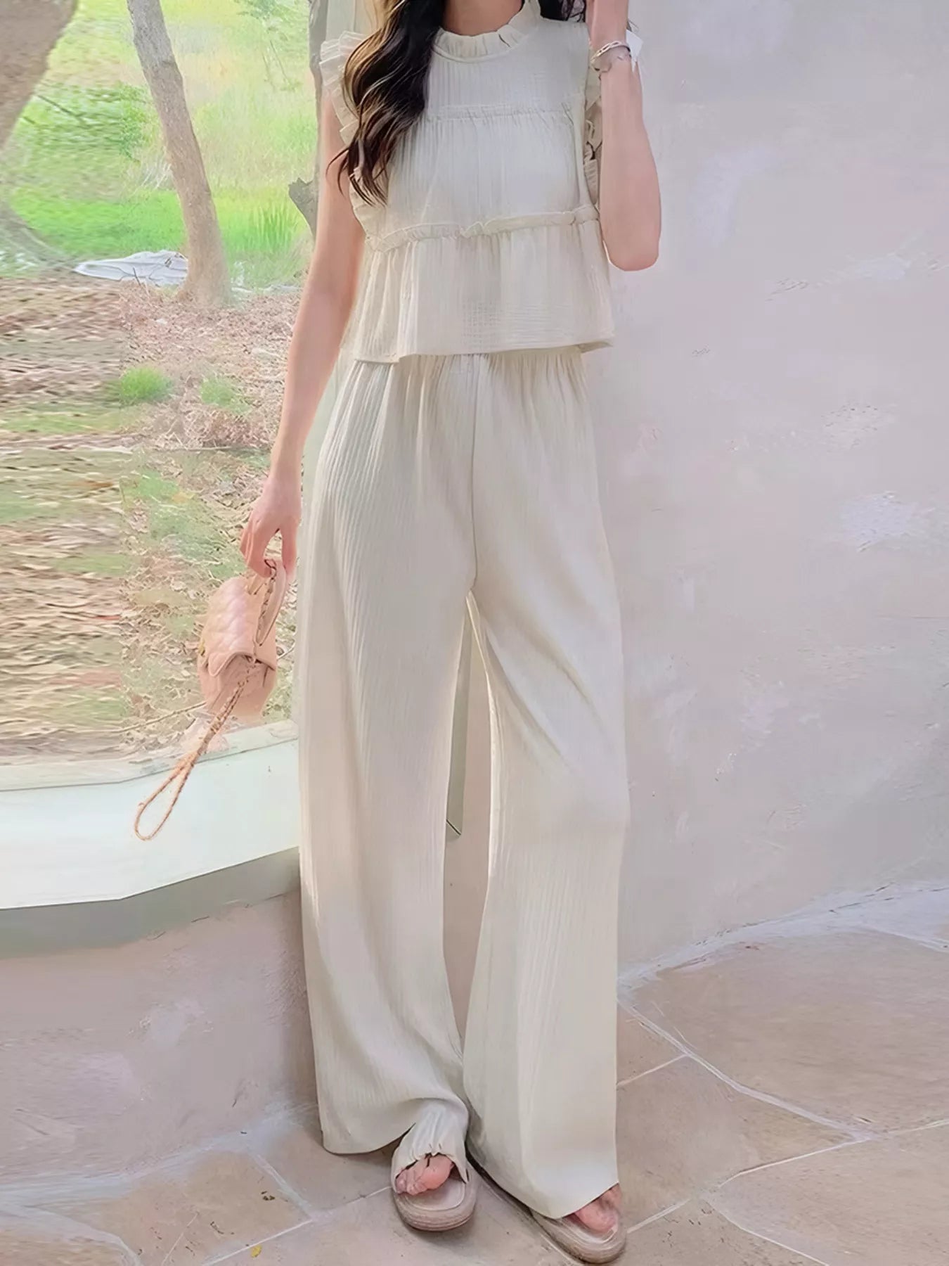 Apricot ruffled sleeveless top and wide-leg pants set with tiered top