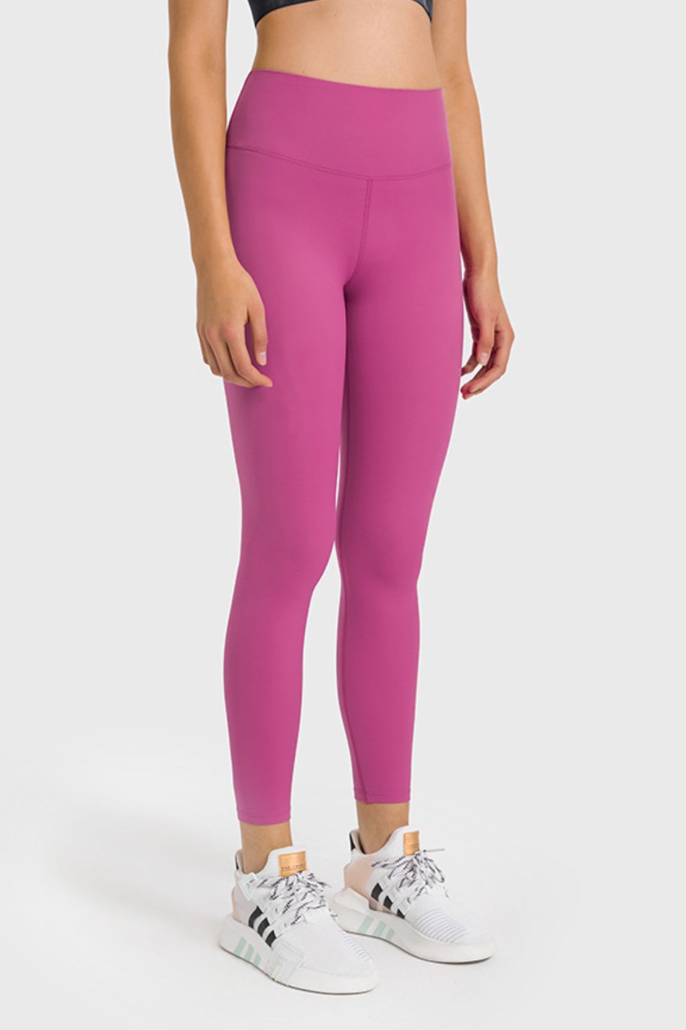 High-waist ankle-length yoga leggings in cerise pink, front full-body view
