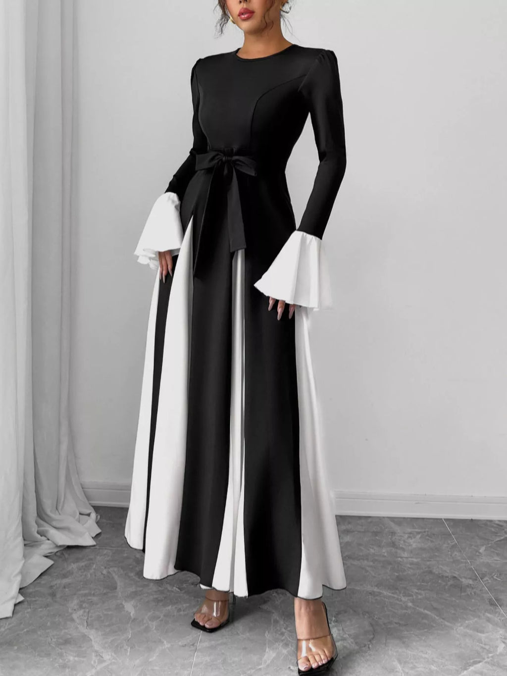 Black maxi dress, round neck, tied waist belt, white contrast bell sleeves