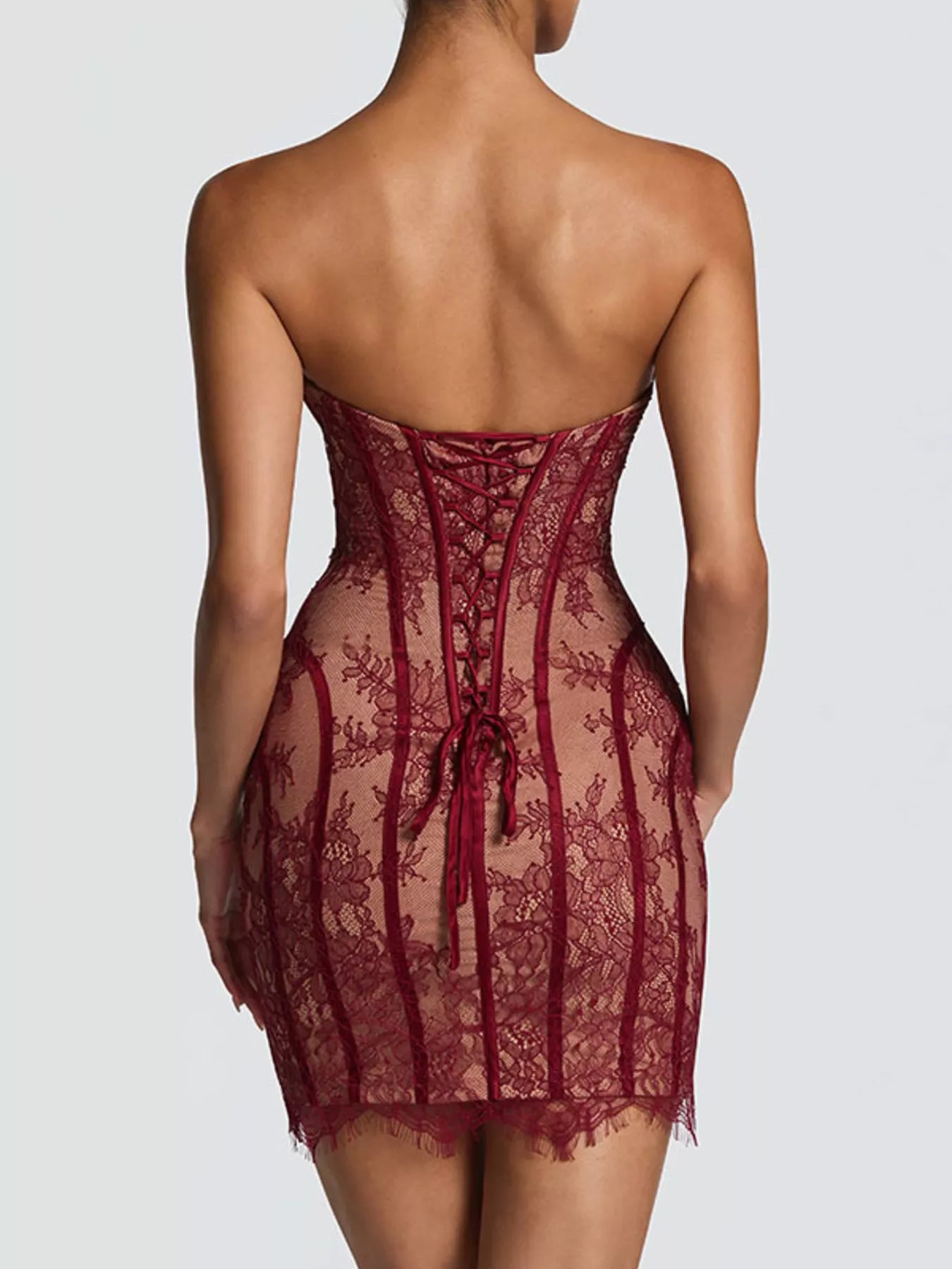 Burgundy lace detail tube mini dress, back view with strapless curved neckline