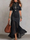 Black mock-neck cold-shoulder denim maxi dress with asymmetrical ruffle hem