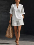 White half-sleeve V-neck top and matching shorts set with notched neckline