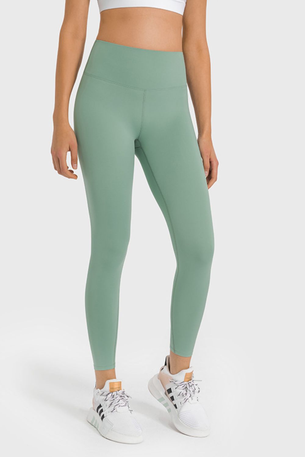 High-waist ankle-length yoga leggings in gum leaf green, full front view