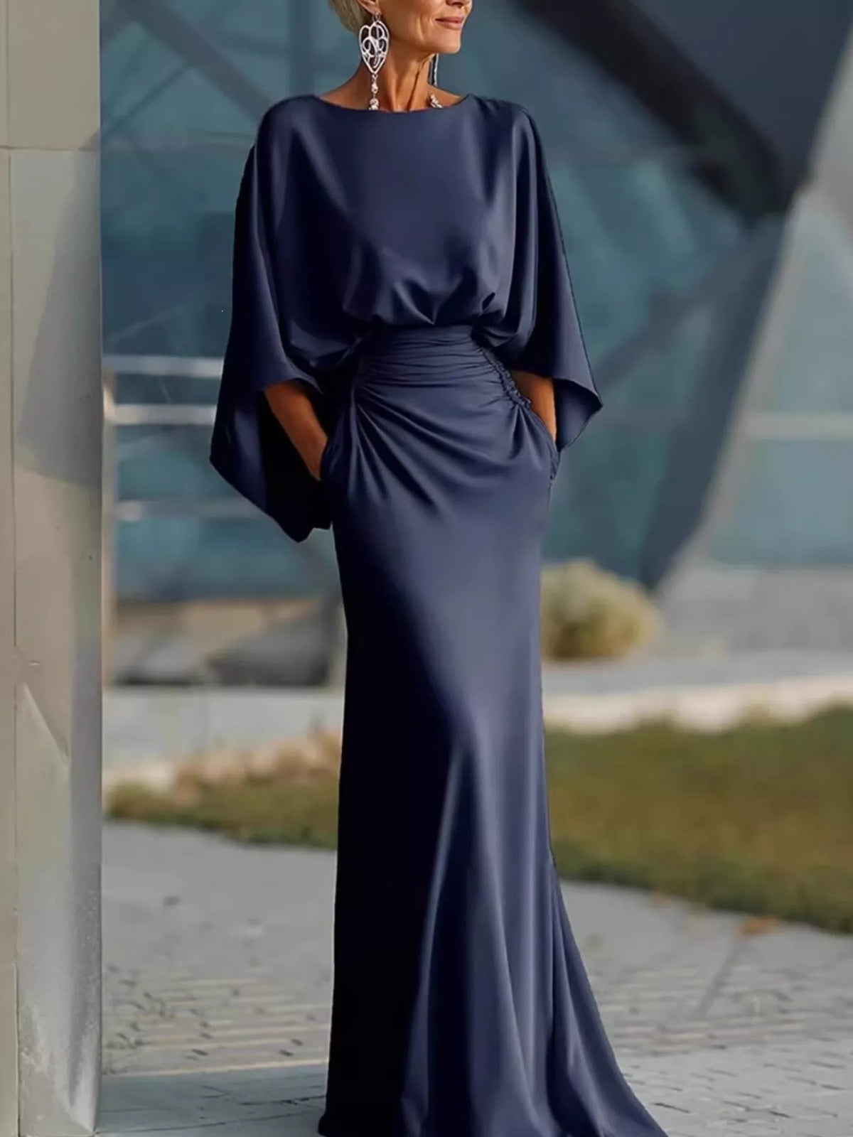 Navy satin maxi dress with batwing sleeves and ruched waist, side drape