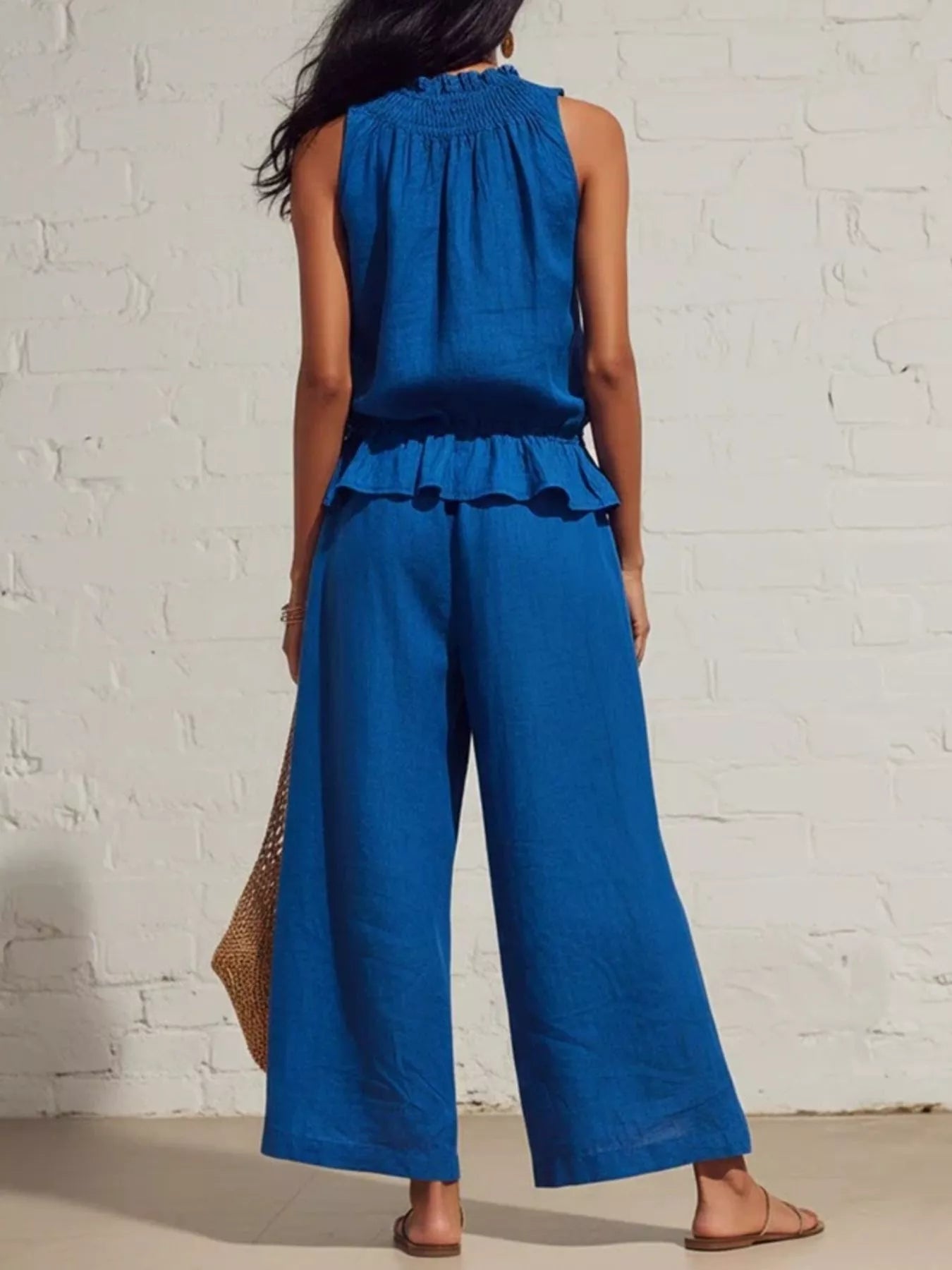 Blue sleeveless top and wide-leg pants set, smocked back yoke and tiered ruffle hem.