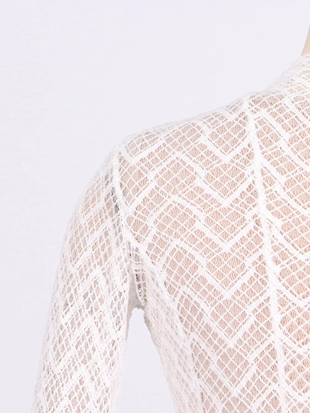White lace long-sleeve maxi dress fabric close-up with geometric diamond mesh
