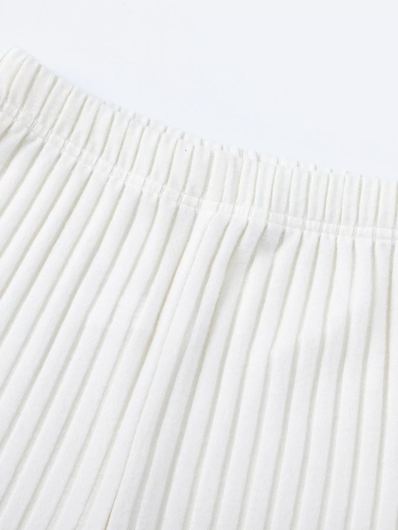 White ribbed knit pants waistband with gathered elastic