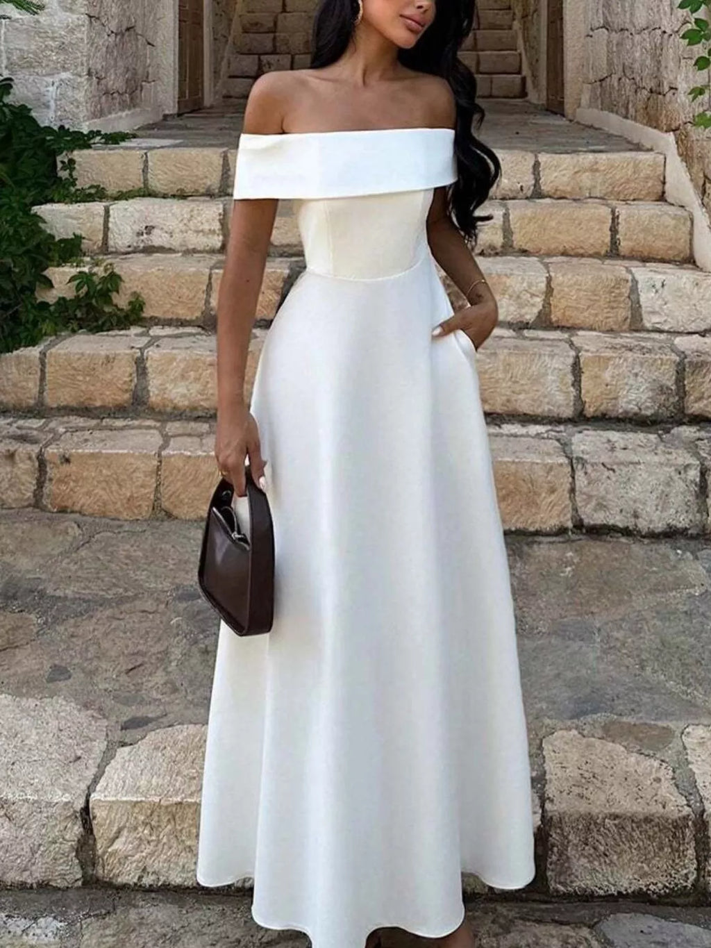 Off-shoulder A-line maxi dress in off-white, fitted bodice, wide neckline and flared skirt
