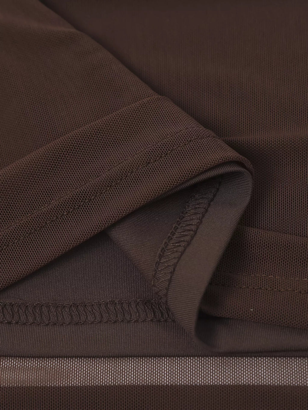 Brown off-shoulder maxi dress neckline seam with textured mesh fabric
