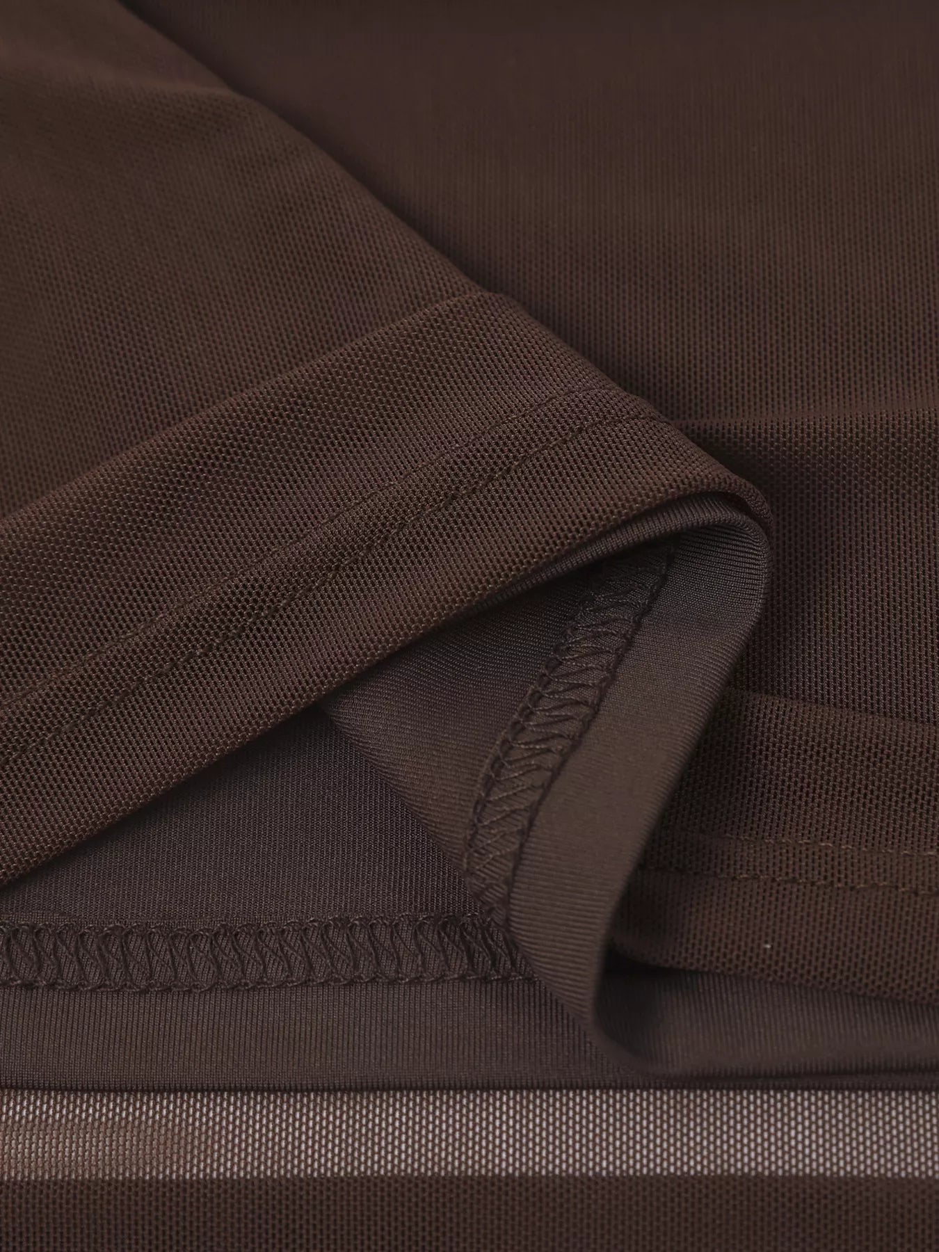 Brown off-shoulder maxi dress neckline seam with textured mesh fabric