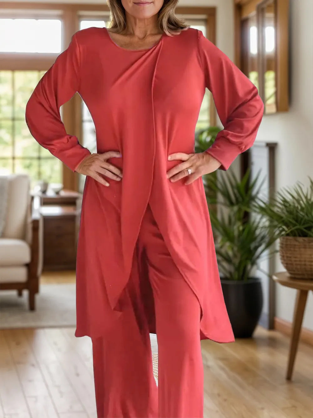 Red long sleeve top and wide-leg pants set with asymmetrical front slit