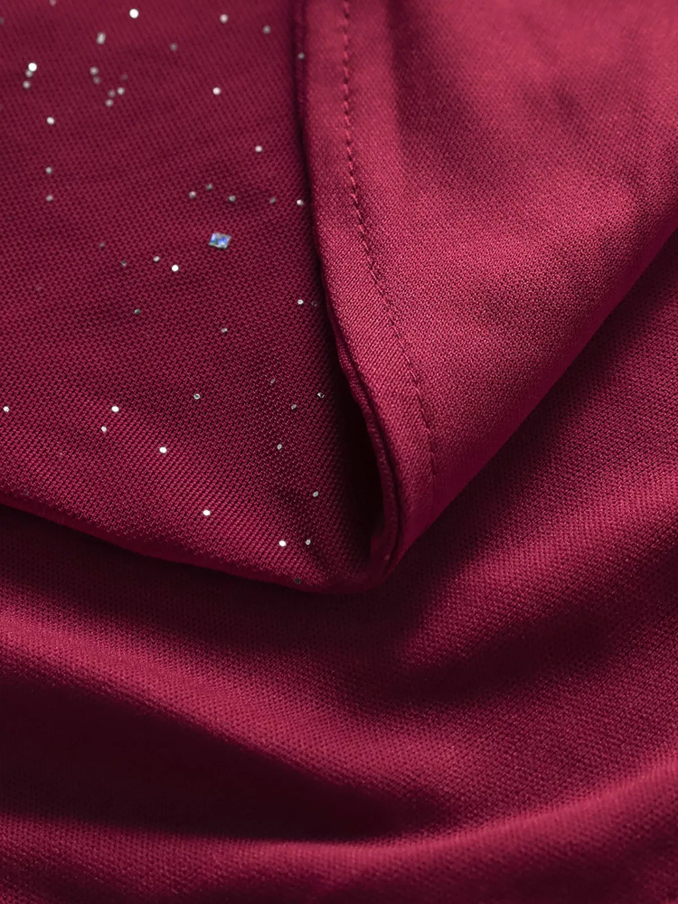 Burgundy glitter maxi dress fabric with folded hem and dotted sparkle