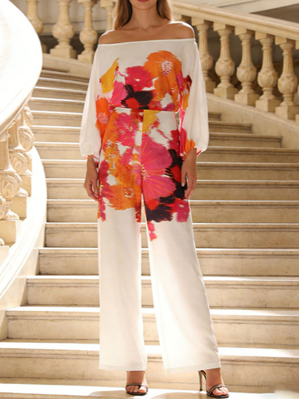 Off-shoulder blouse with multicolor floral print and white wide-leg pants