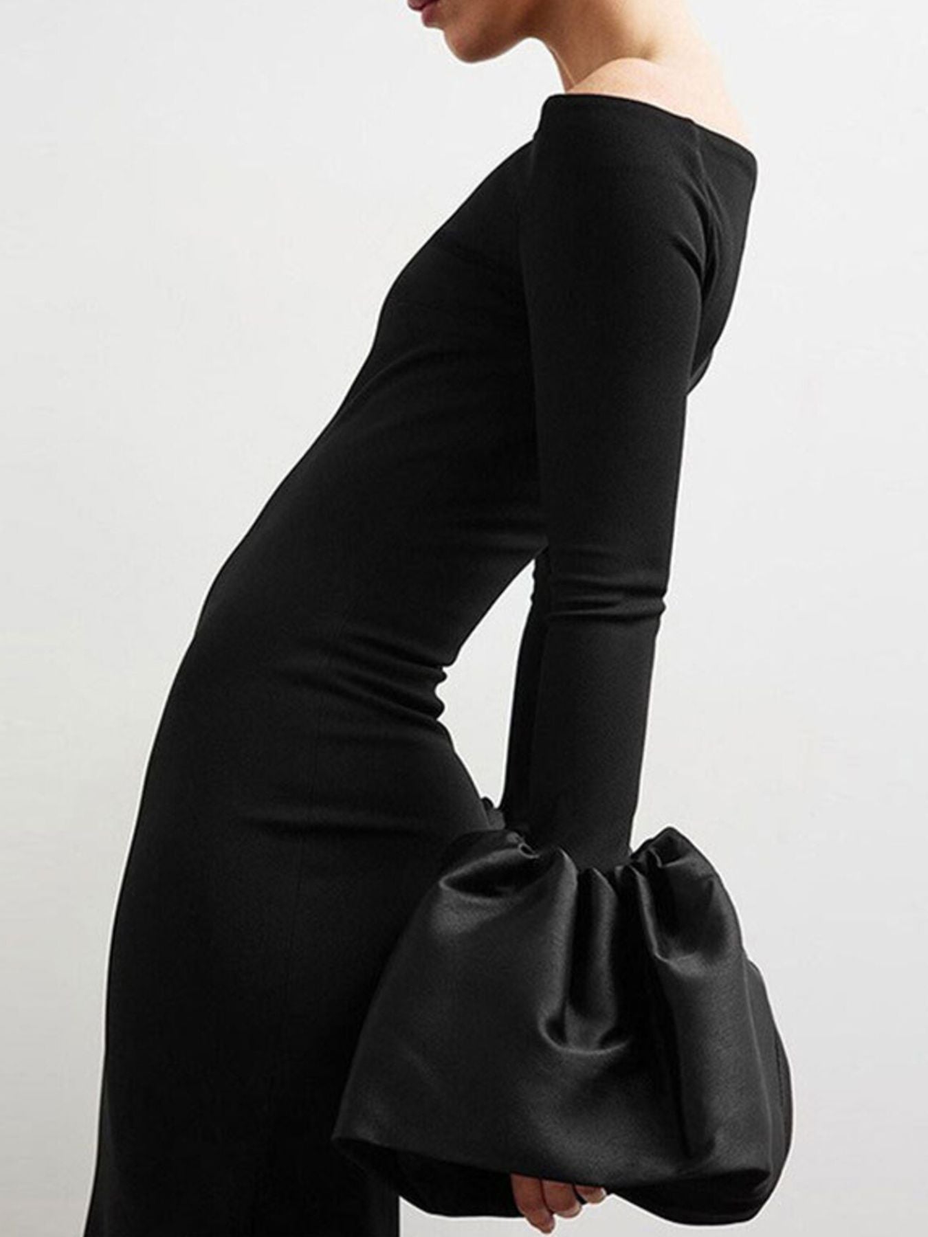 Black off-shoulder fitted maxi dress with long sleeves and ruched flounce cuffs