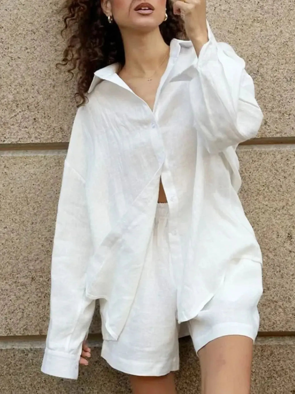 White button-up long-sleeve shirt and matching shorts set, side view